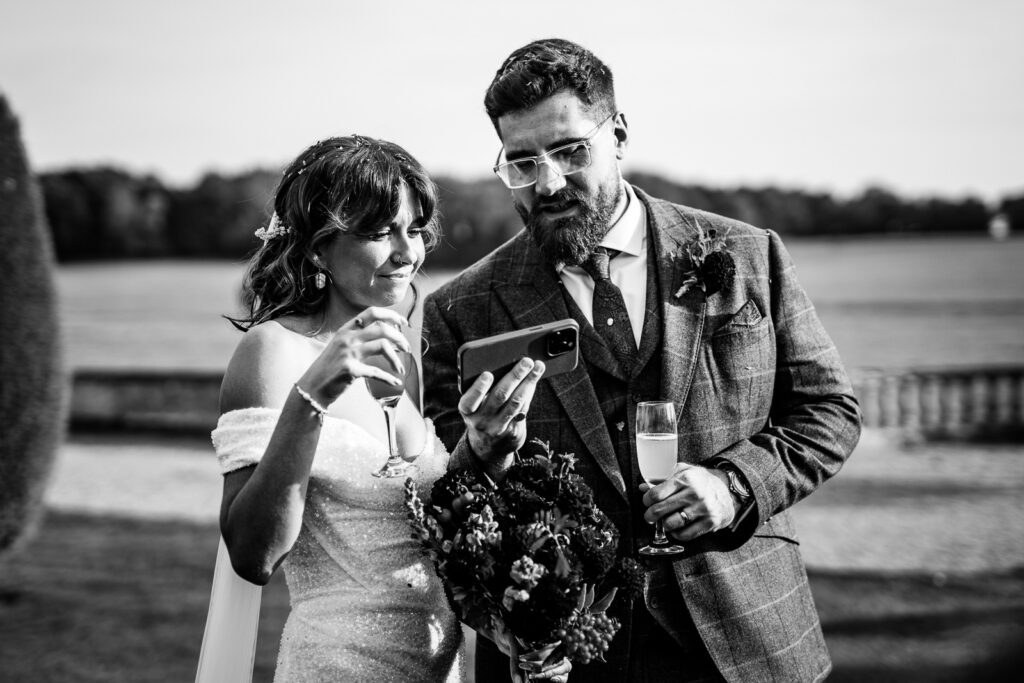 Bride and groom at Prestwold Hall calling the absent family