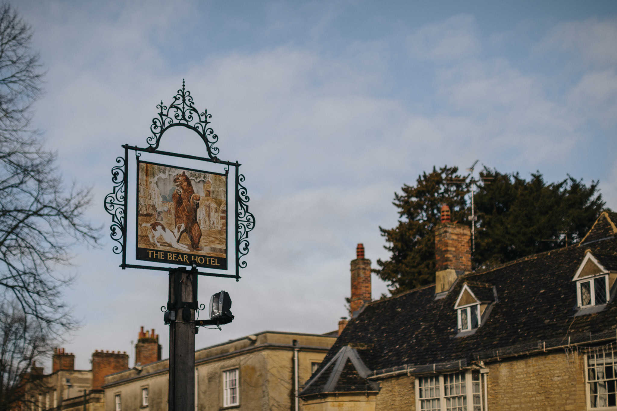 Ornate sign of The Bear Hotel in Woodstock, Oxfordshire, a historic and elegant wedding reception venue in the Cotswolds, perfect for intimate celebrations and timeless photography.