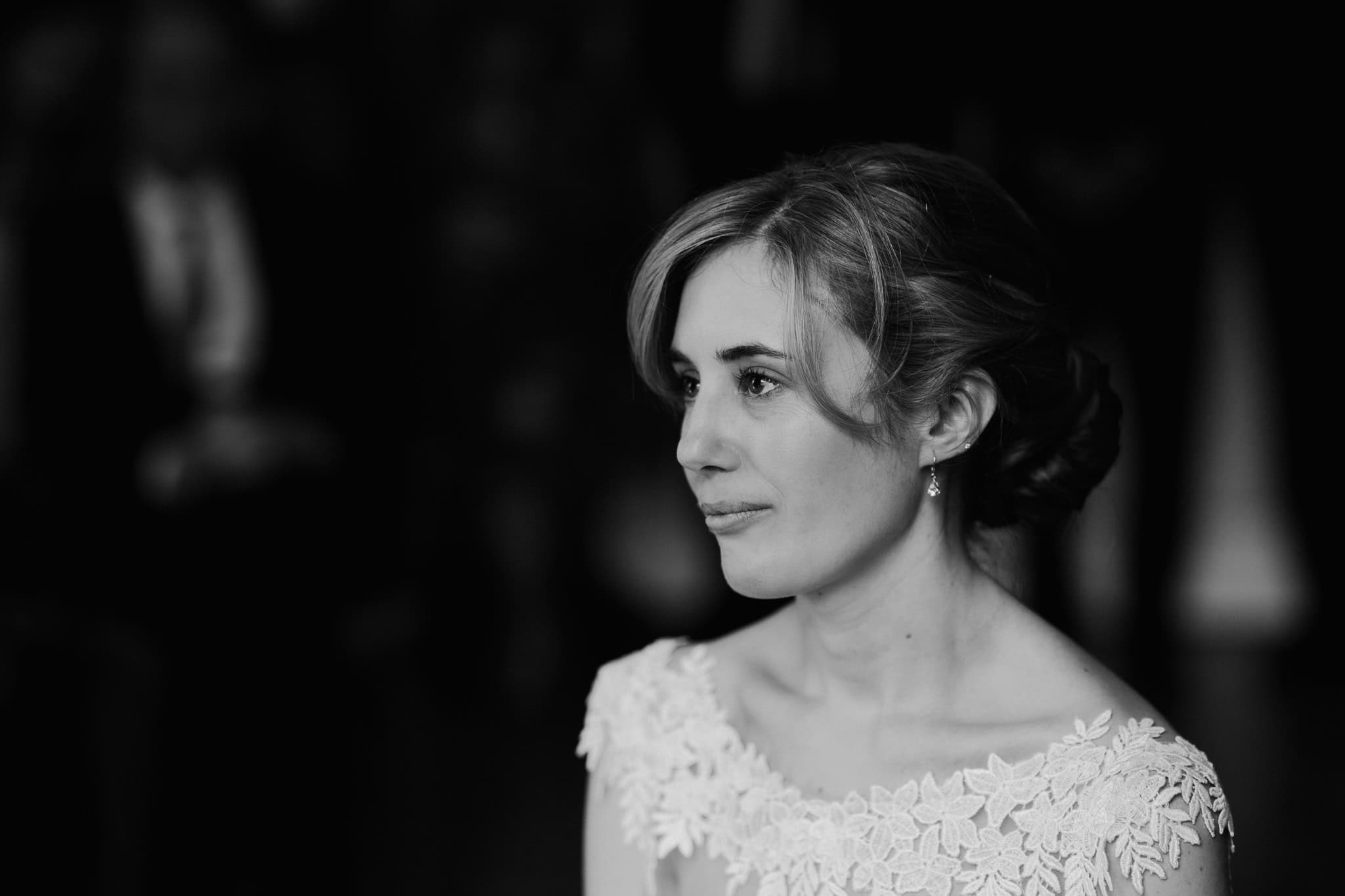 Black and white portrait of a bride at Woodstock Town Hall, capturing an emotional and elegant moment. A stunning and timeless wedding photograph filled with beauty and grace.