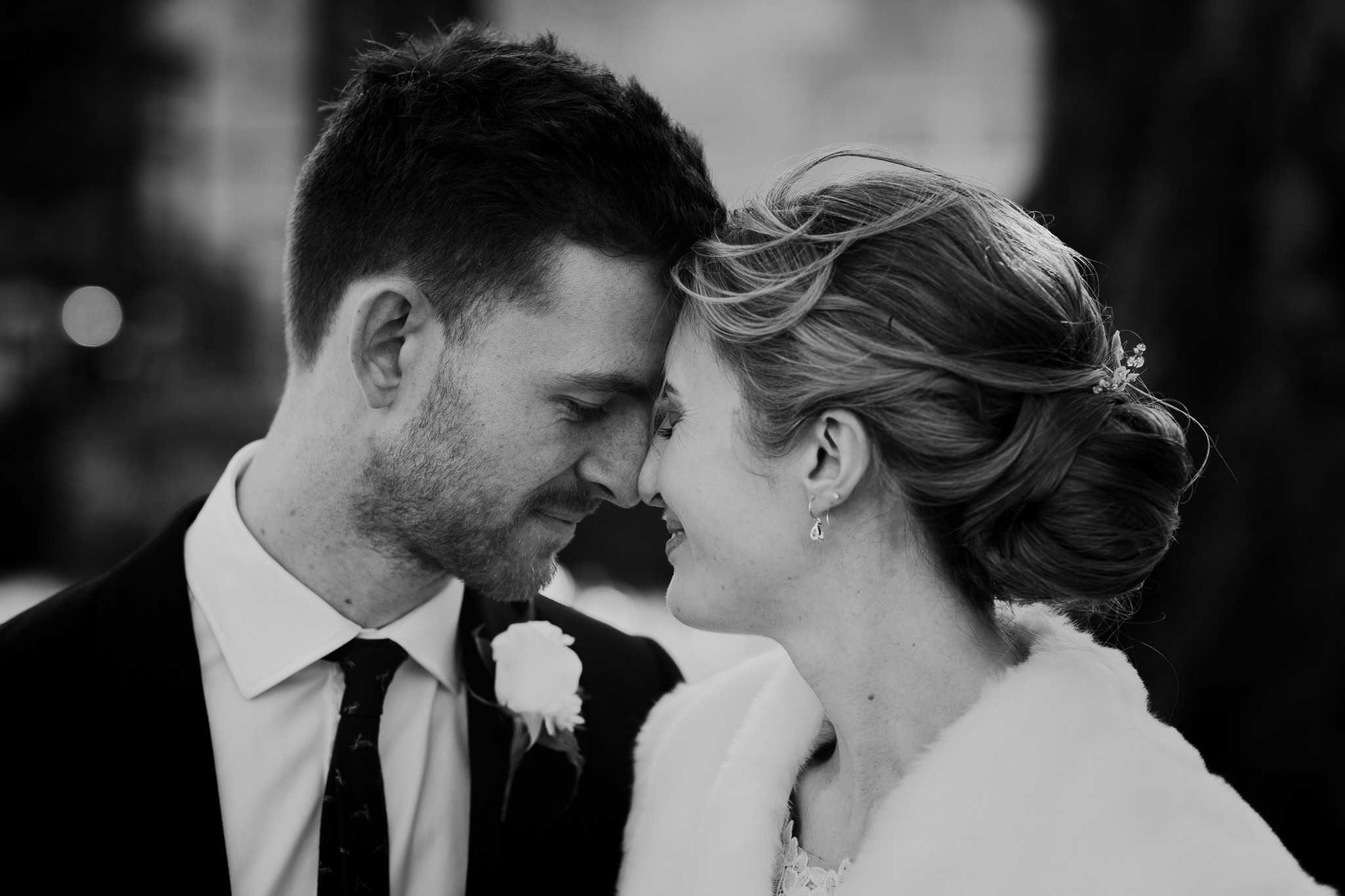 A romantic black and white close-up of a bride and groom touching foreheads after their Woodstock Town Hall wedding. A timeless and emotional moment captured in Oxfordshire wedding photography.